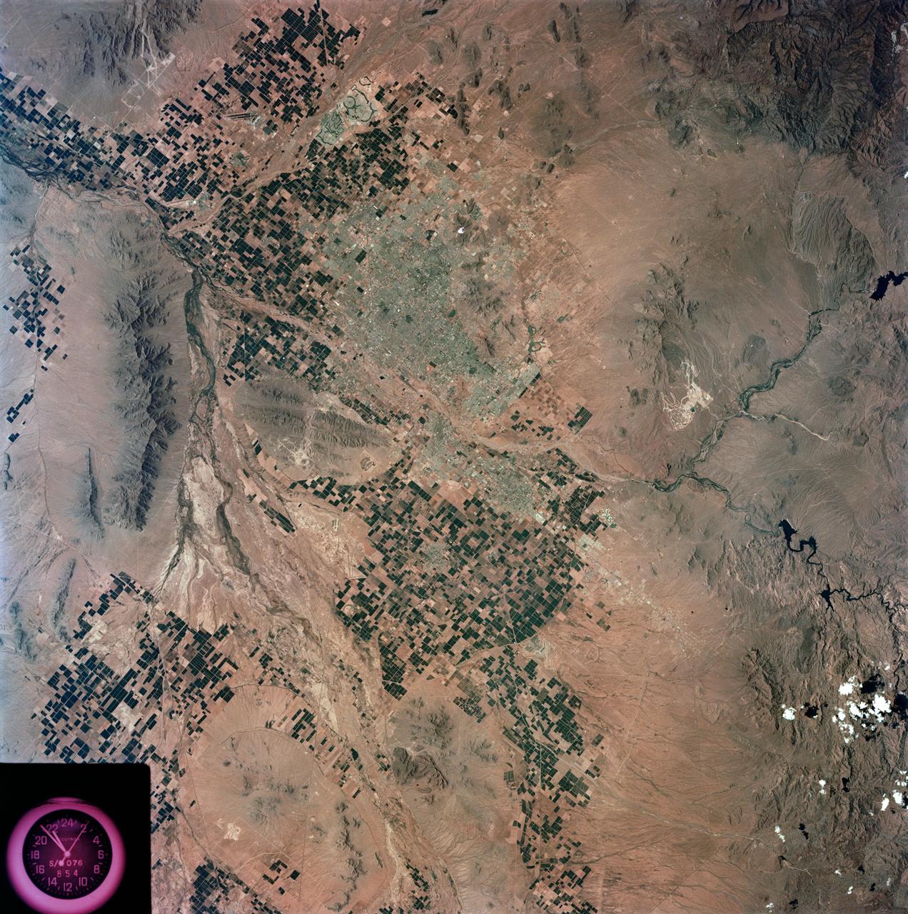 S73-35078 (July-Sept. 1973) --- A nearly vertical view of the Phoenix, Arizona metropolitan area is seen in this Skylab 3 (second manning) Earth Resources Experiments Package S190-B (five-inch Earth terrain camera) photograph taken from the Skylab space station in Earth orbit. Also in the picture are Scottsdale, Paradise Valley, Tempe, Mesa, Komatke, Salt River Indian Reservation and part of the Gila River Indian Reservation. Features which can be delineated from the photograph include: cultural patterns defined by commercial, industrial, agricultural and residential areas; transportation networks consisting of major corridors, primary, secondary and feeder streets; major urban developments in the area such as airports, Squaw Peak City Park, Turf Paradise Race Track and the State Fairgrounds. Phoenix is one of the 27 census cities of interest under study by the U.S. Geological Survey and is the center of the Arizona Regional Ecological Test Site. A large number of investigators will be using the Skylab data. This photo will be compared to earlier ones to document changes in the urban area with time. The landscape is well defined in terms of mountains, alluvial fans and river flood plains. Several different types of natural vegetation and irrigated crop lands can be mapped. Geological features are not well displayed but mining activities are readily identified. Photo credit: NASA