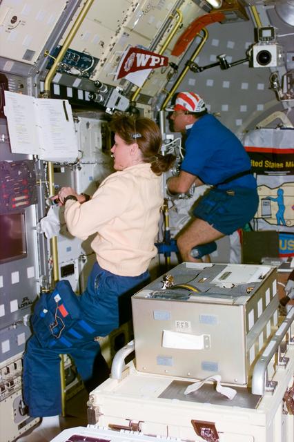 DPM and Glovebox, Payload Commander Kathy Thornton and Payload Specialist Albert Sacco in Spacelab