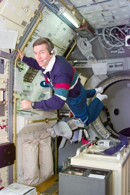 NASA image: STDCE, Payload Specialist Fred Leslie works in the Spacelab