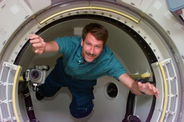 NASA image: Pilot Kent Rominger floats in tunnel