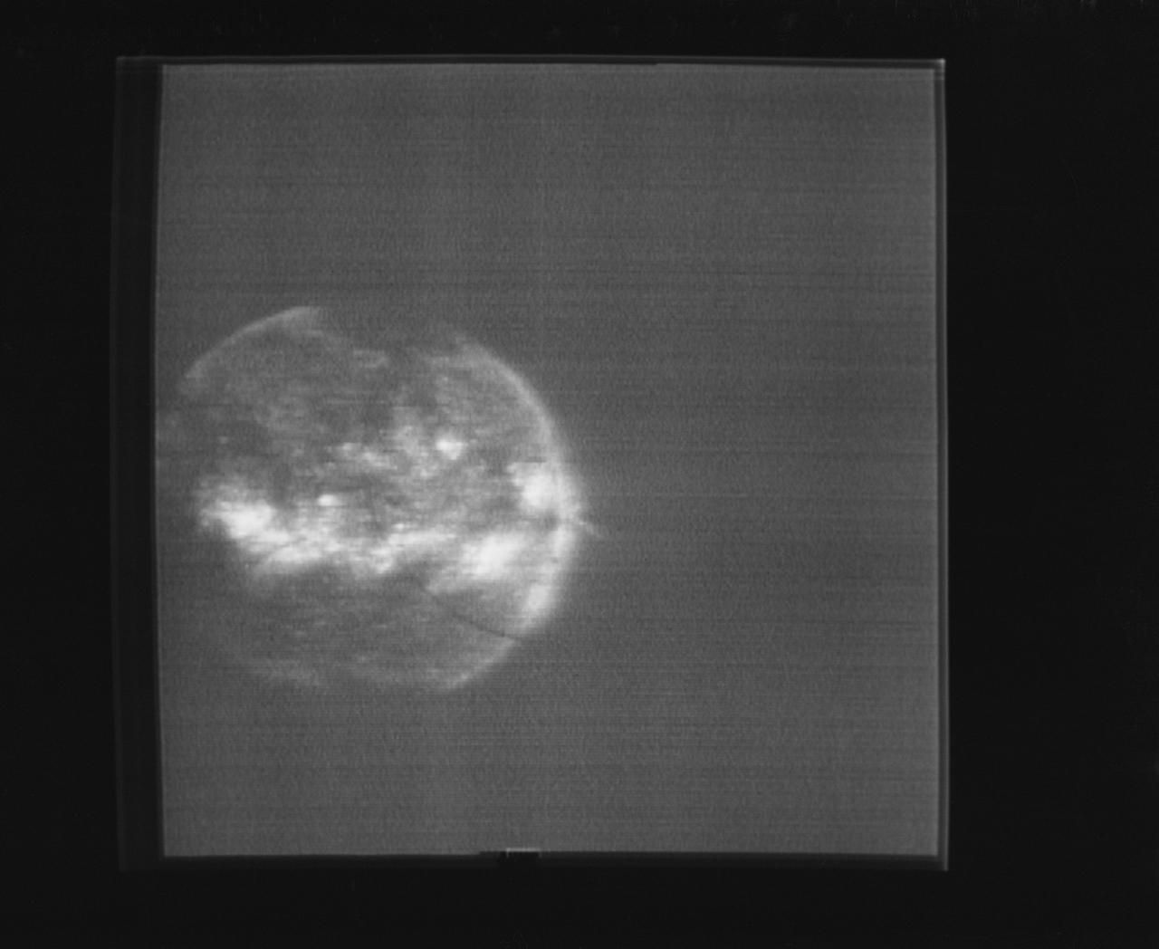 S74-15696 (1974) --- The solar disk photographed through the Skylab S082 Ultraviolet Spectrograph/Heliograph can be seen in this reproduction taken from a television tranmission made by a TV camera aboard the Skylab space station in Earth orbit. The S082 experiment is located in the Apollo Telescope Mount. This spectroheliogram shows specific emission features greatly enhanced over photographs of the solar disk in white light. Photo credit: NASA