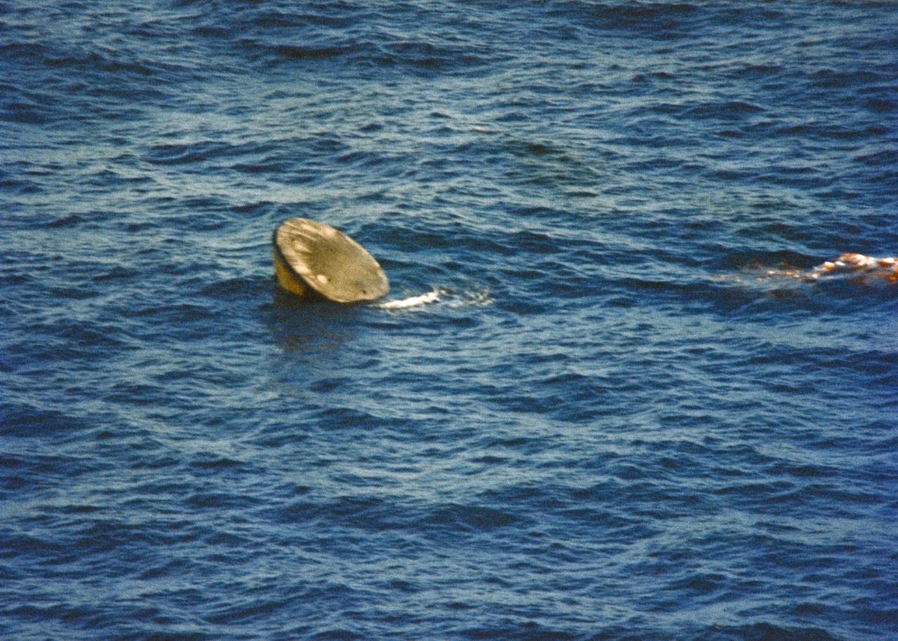 S74-17742 (8 Feb. 1974) --- The Skylab 4 Command Module bobs in an apex-down configuration (stable two) in the calm water of the Pacific Ocean 176 miles southwest of San Diego, California, following a successful splashdown and 84-day mission in Earth orbit. Photo credit: NASA