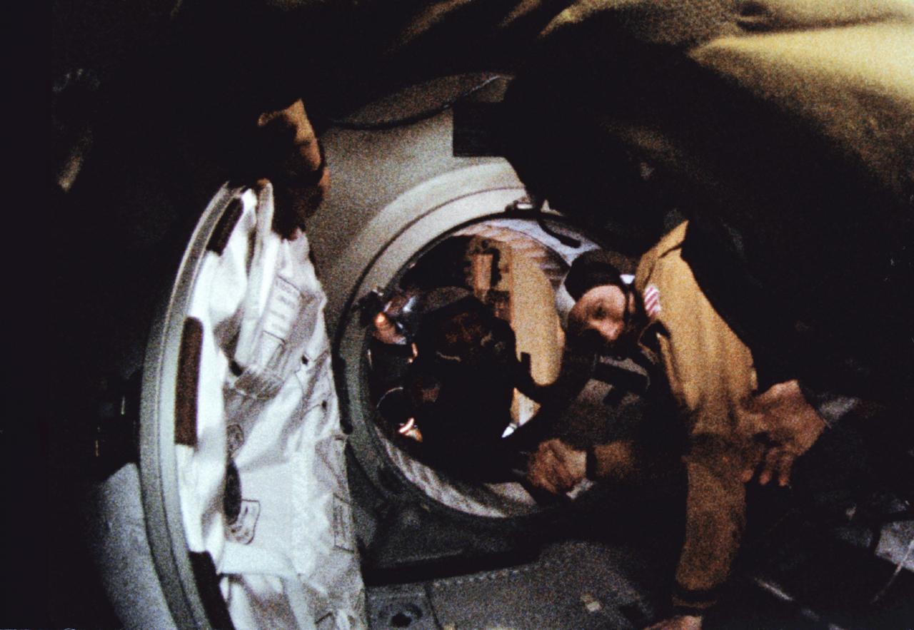 S75-29432 (17 July 1975) --- Astronaut Thomas P. Stafford (in foreground) and cosmonaut Aleksei A. Leonov make their historic handshake in space on July 17, 1975 during the joint U.S.-USSR Apollo Soyuz Test Project (ASTP) docking mission in Earth orbit. This picture was reproduced from a frame of 16mm motion picture film. The American and Soviet spacecraft were joined together in space for approximately 47 hours on July 17th, 18th, 19th, 1975. The Apollo crew consisted of astronauts Thomas P. Stafford, commander; Donald K. "Deke" Slayton, docking module pilot; Vance D. Brand, command module pilot.  The Soyuz 19 crew consisted of cosmonauts Aleksei A. Leonov, command pilot; and Valeri N. Kubasov, flight engineer.