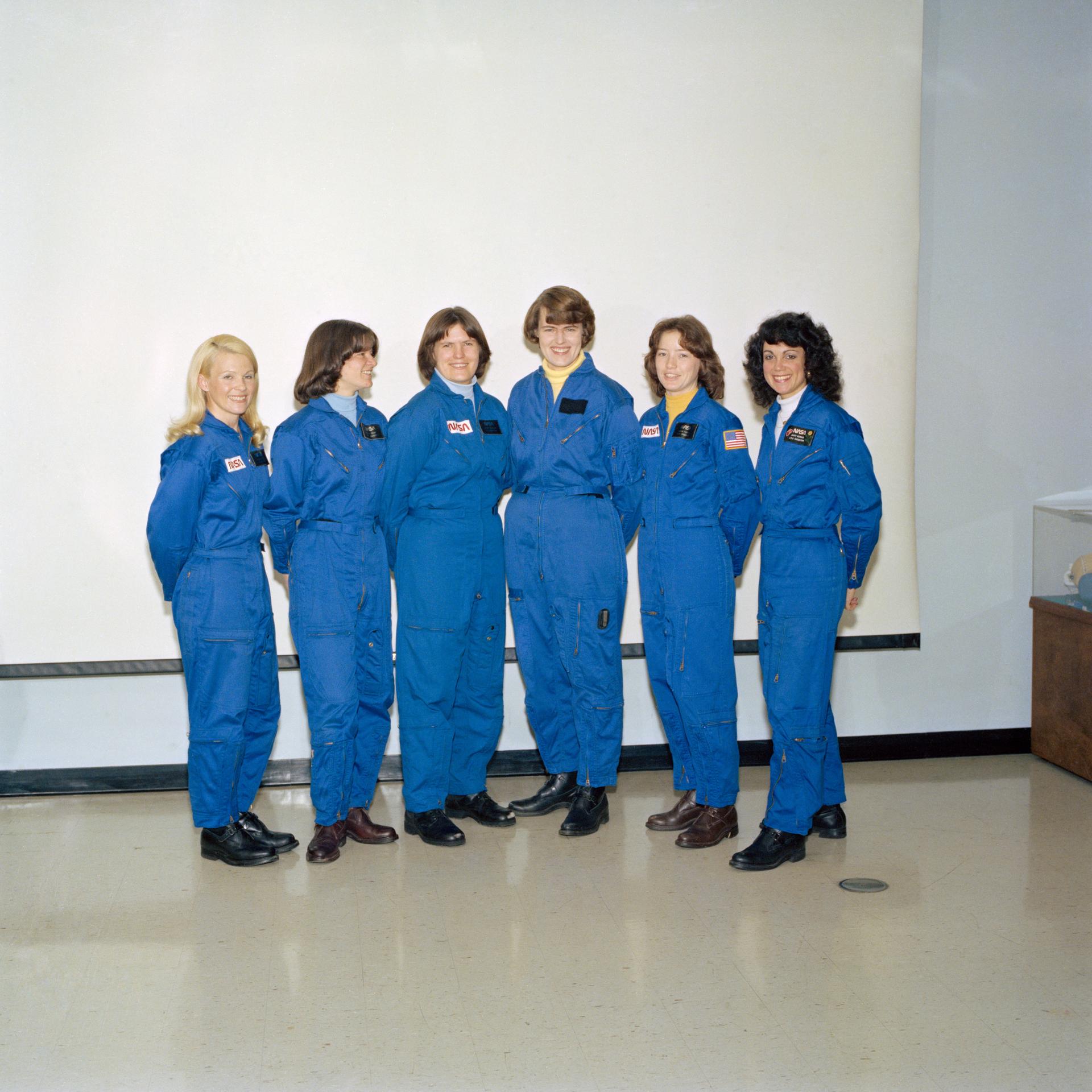 Sporting their new Shuttle-type constant-wear garments, these six astronaut candidates pose for a picture in the crew systems laboratory at the Johnson Space Center (JSC). From left to right are Rhea Seddon, Sally K. Ride, Kathryn D. Sullivan, Shannon W. Lucid, Anna L. Fisher and Judith A. Resnik.