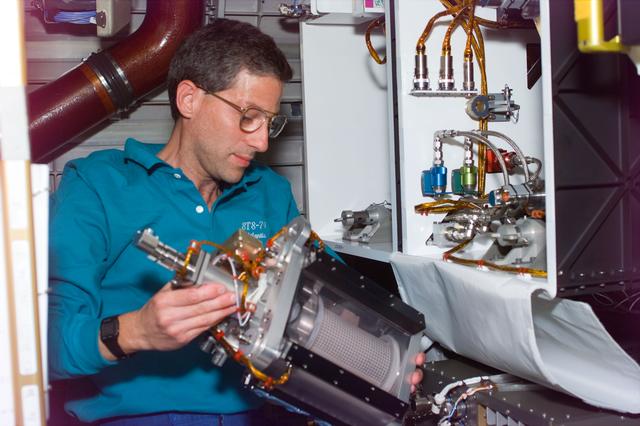 NASA image: MGM - Apt works with MGM experiment chamber