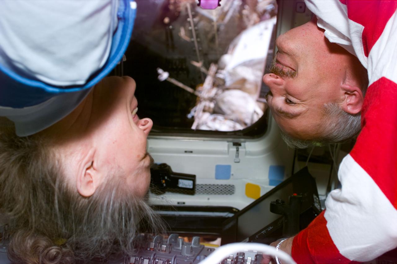 STS79-E-5078 (19 September 1996) --- Astronaut and cosmonaut guest researcher Shannon W. Lucid sees her first astronaut visitors since March 1996, as she greets William F. Readdy, STS-79 commander, during Flight Day 4.  Some of Russia's Mir Space Station's components can be seen through the window in background.  Lucid is to return to Earth with Readdy's crew in a few days.
