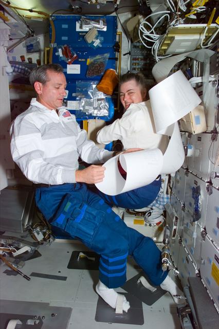 NASA image: Astronaut Akers with TIPS messages