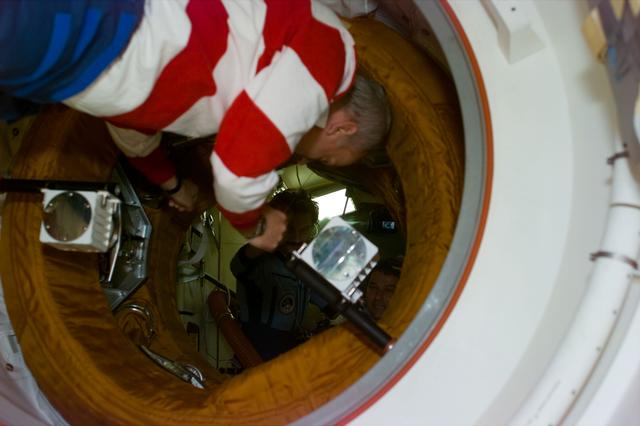 NASA image: STS-79 commander at entrance to docking module