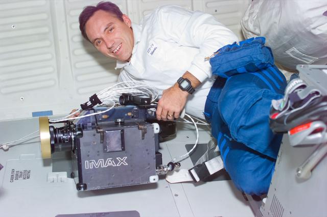 NASA image: Astronaut Walz with the IMAX camera on the middeck