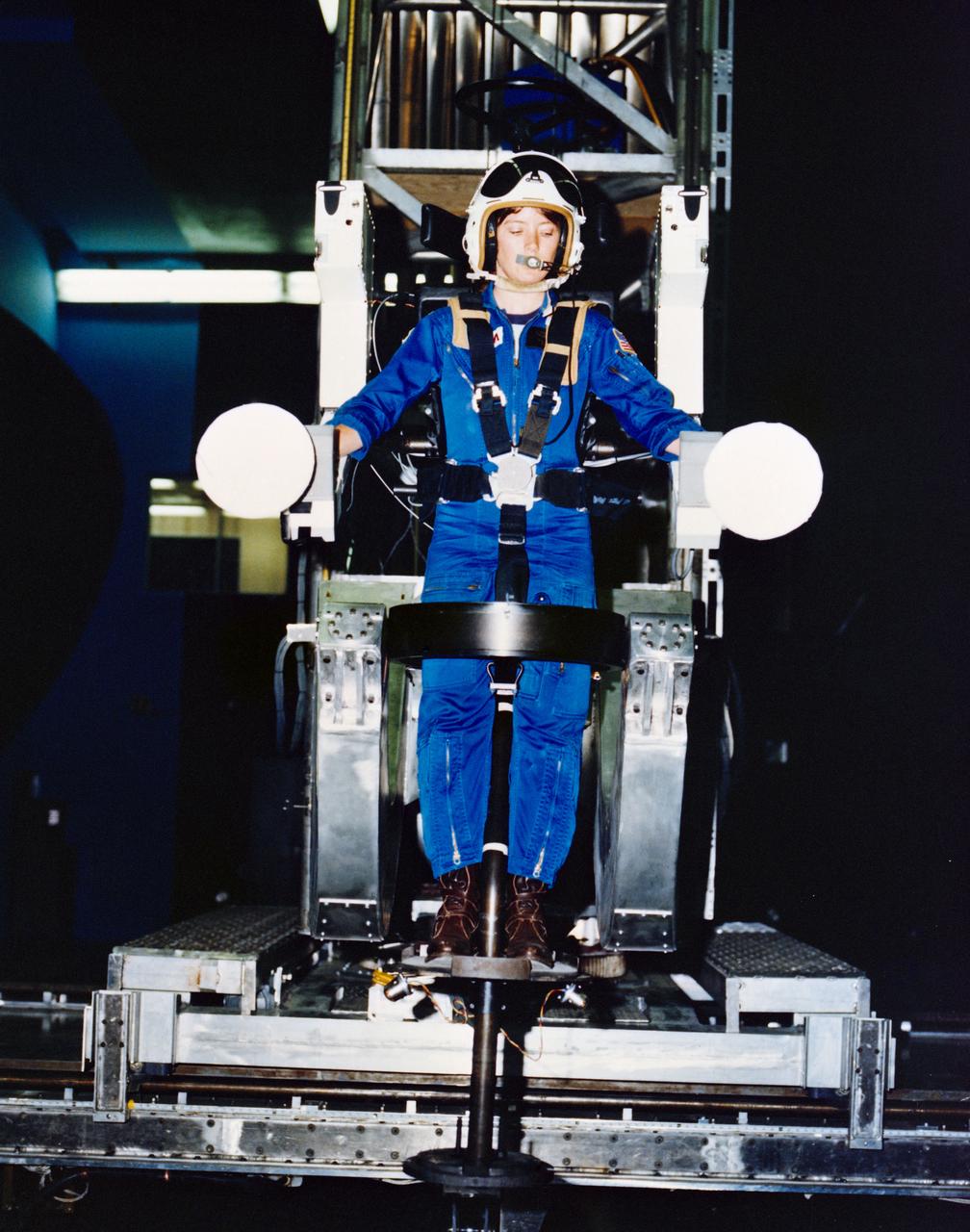 S80-36844 (24 July 1980) --- Manned Maneuvering Unit (MMU) development at the Martin Marietta plant in Denver, Colorado. View shows MMU prototype with astronaut AnnaL. Fisher serving as test subject strapped in to it. Photo credit: NASA