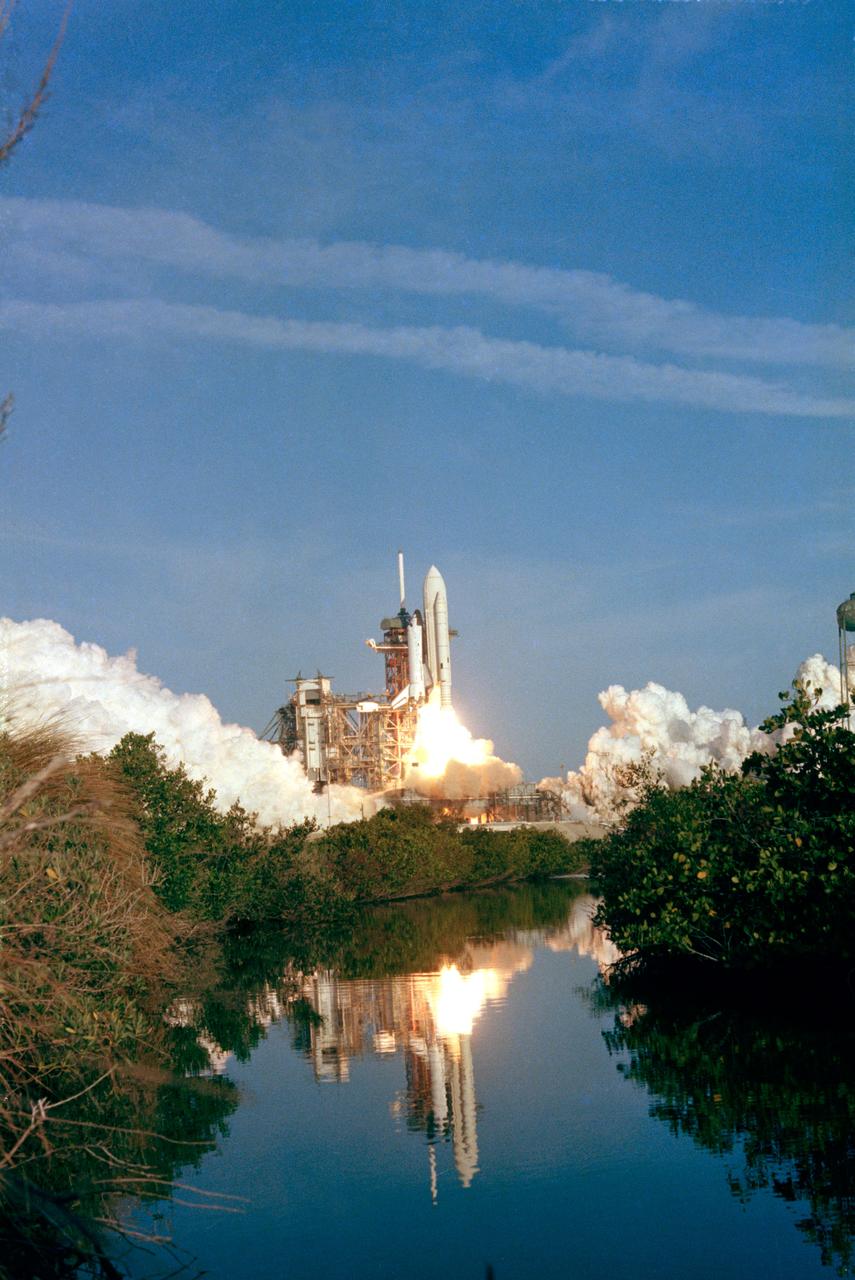 S81-30462 (12 April 1981) --- The space shuttle Columbia rises off Pad 39A a few seconds past 7 a.m. (EST) on April 12, 1981.  Onboard, astronauts John W. Young, STS-1 commander, and Robert L. Crippen, pilot, head toward an Earth-orbital mission which represents the beginning of a new era in space transportation. Thousands of persons were in the area to view the historic launch. Photo credit: NASA or National Aeronautics and Space Administration