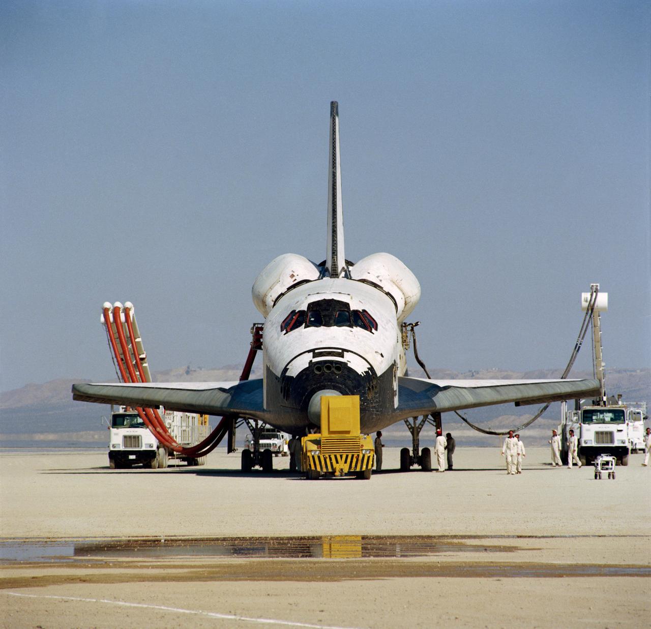 S81-31913 (14 April 1981) --- This head-on photograph of NASA's space shuttle Columbia was taken during post-landing servicing on Rogers dry lake bed at Edwards Air Force Base in southern California. The STS-1 mission ended earlier today, two and one third days later and thousands of miles removed from Sunday's Florida launch setting. Astronauts John W. Young, commander, and Robert L. Crippen, pilot, were Columbia's first crew. Photo credit: NASA
