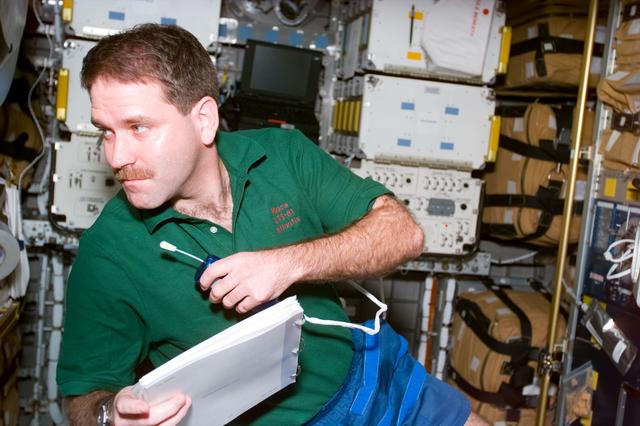 NASA image: MS Grunsfeld with microphone in Spacehab