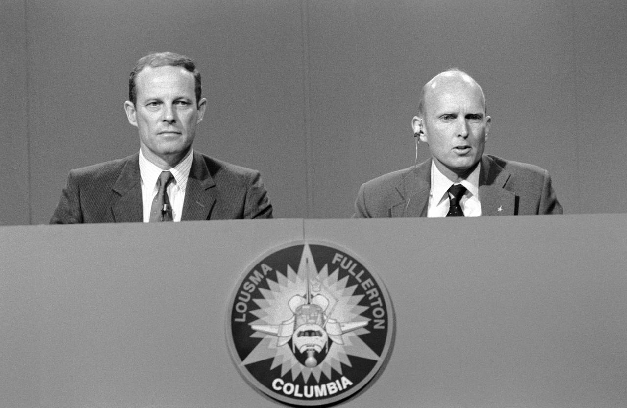 S82-27686 (26 Feb. 1982) --- Astronauts Jack R. Lousma, left, commander, and C. Gordon Fullerton, pilot, answer questions from the press corps during their final pre-STS-3 press conference on Feb. 26, 1982. The two will man the space shuttle Columbia when it launches on March 22, 1982, from the Kennedy Space Center's Launch Pad 39A. Photo credit: NASA