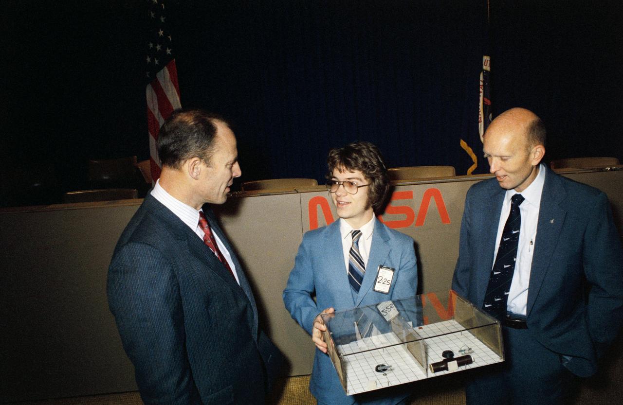 S82-27835 (26 Feb. 1982) --- The astronaut crew members for NASA?s third space transportation system (STS-3) flight meet with Todd E. Nelson, who devised a scientific experiment to fly on their mission. Astronauts Jack R. Lousma, left, commander, and C. Gordon Fullerton, pilot, along with the 18-year-old high school senior, discussed the experiment, entitled ?Insects in Flight Motion Study,? during a press briefing in JSC?s public affairs facility. Photo credit: NASA