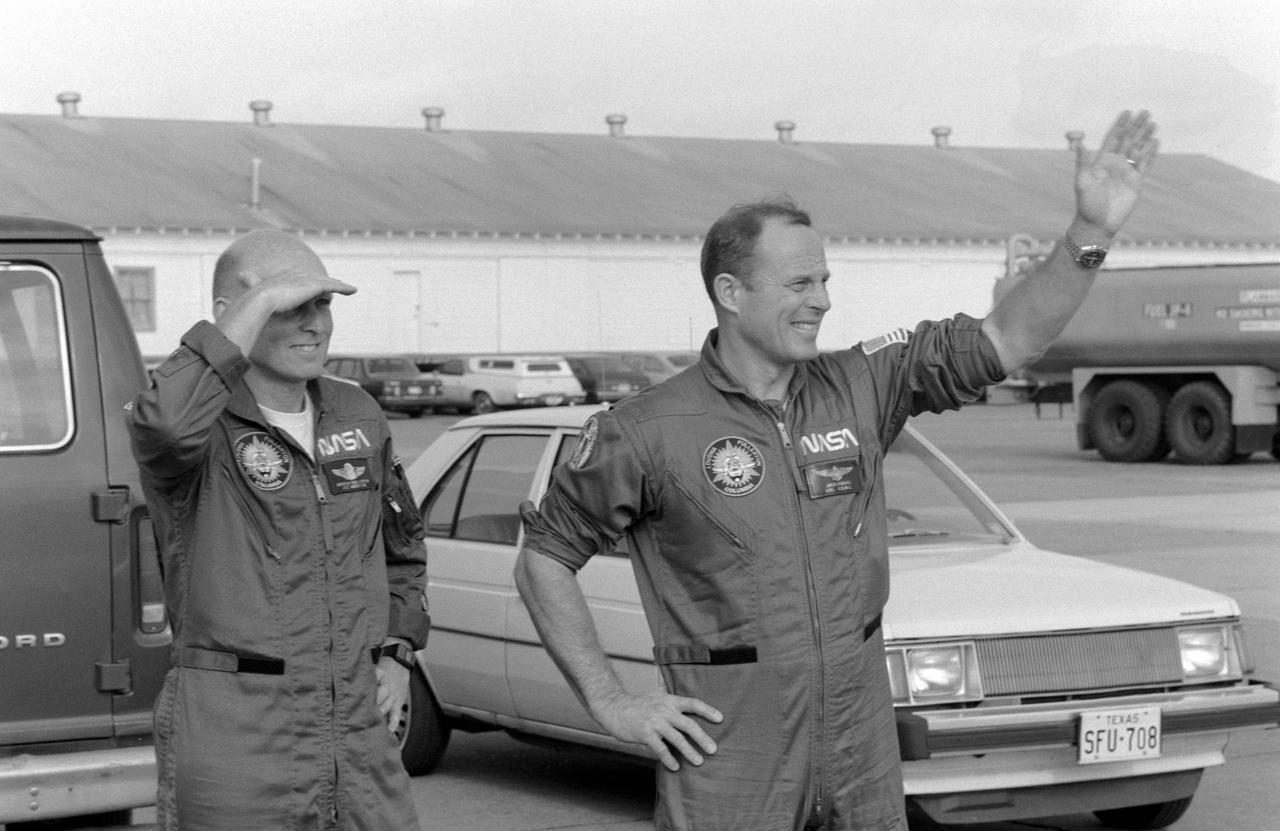 S82-28706 (20 March 1982) --- Astronaut Jack R. Lousma, right, STS-3 commander, and C. Gordon Fullerton, greet a crowd on hand at Ellington Air Force Base to bid them farewell prior to their departure to KSC in a pair of T-38 jet aircraft. The two are scheduled to liftoff in less than 48 hours from the Kennedy Space Center?s Launch Pad 39A, for the third in a series of space transportation system (STS-3) flights. Photo credit: NASA