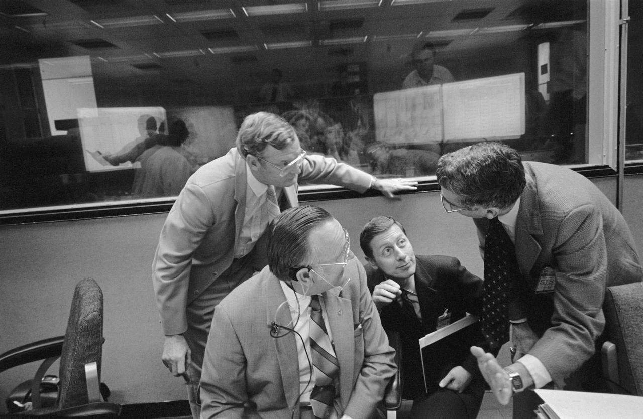 Mission Control Activities during the STS-3 Mission, Day-4 with: Maj. Gen. James A. Abrahamson, Associate Administrator of the Space Transportation System (STS), NASA Hdqs., conversing with Dr. Kraft; Glynn S. Lunney, Manager, Space Shuttle Program Office, JSC, Aaron Cohen, Manager, Space Shuttle Orbiter Project Office; and, J. E. Conner, Ford Aerospace Engineer at the Instrumentation and Communications Officer (INCO) Console position. 1. Glynn S. Lunney 2. Major General James A. Abrahamson 3. Aaron Cohen 4. J. E. Conner 5. Dr. Christopher Kraft JSC, Houston, TX