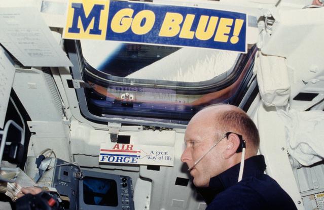 NASA image: Pilot Fullerton reviews checklist on Aft Flight Deck Onorbit Station