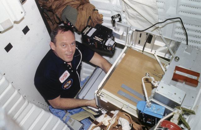 NASA image: Commander Lousma works with EEVT experiment on aft middeck