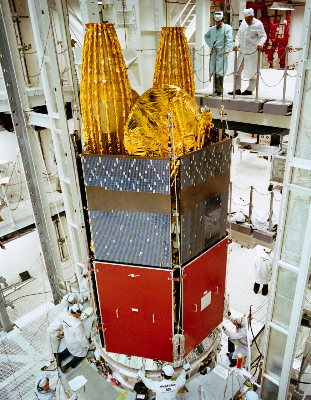 S82-41171 (29 Nov. 1982) --- NASA?s tracking and data relay satellite (TDRS) is gently mated to its inertial upper stage (IUS), which will propel the satellite to a higher geosynchronous orbit after it is ejected from the Challenger?s cargo bay during STS-6. Another TDRS will be placed in orbit on a later shuttle mission. The two will provide communications between orbiting shuttle mission craft and the ground, resulting in increased real-time communication and eliminating the need for much of NASA?s extensive world-wide system of ground tracking stations. A more distant plan is to launch other TDRS to be used for commercial telecommunications and for handling peak loads. Photo credit: NASA