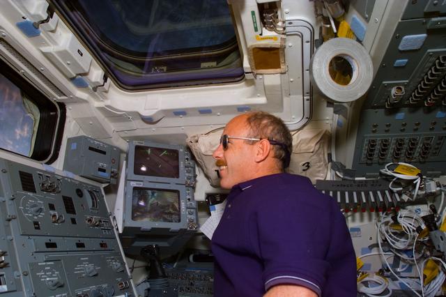 NASA image: Commander Kenneth D. Bowersox looks out the aft flight deck window