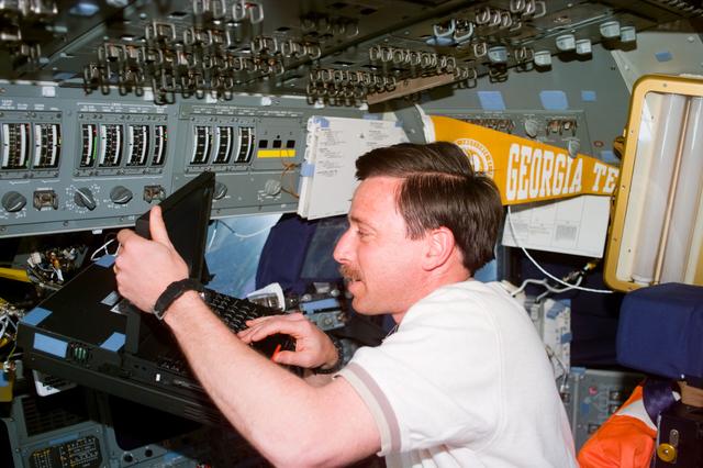 NASA image: Crewmember activity in the flight deck