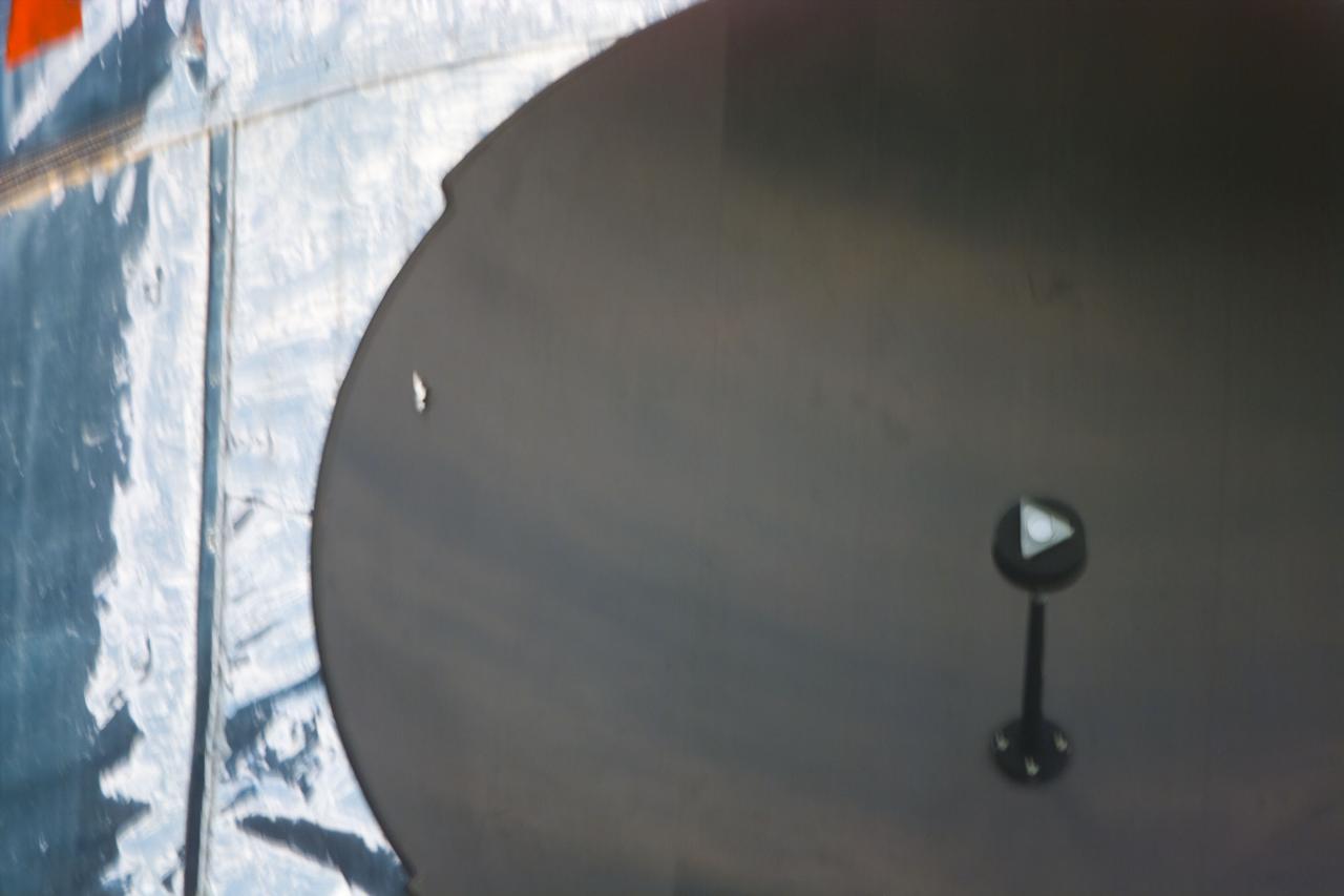 S82-E-5109 (13 Feb. 1997) --- A close-up survey view of Hubble Space Telescope (HST) recorded with the Electronic Still Camera (ESC) shows the high gain antenna.