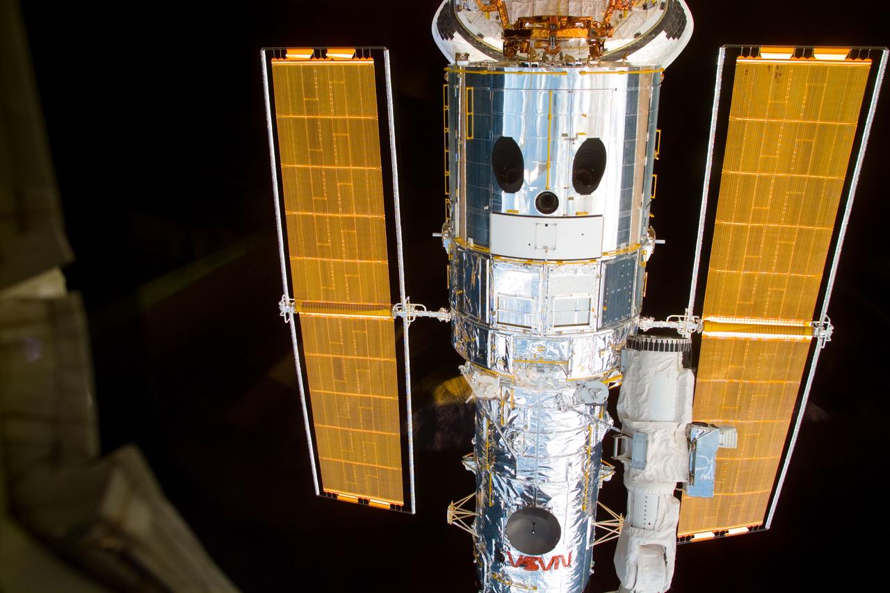 S82-E-5147 (13 Feb. 1997) --- A front-lighted full view of the captured Hubble Space Telescope (HST) backdropped against a dark space background. This view was taken with an Electronic Still Camera (ESC).