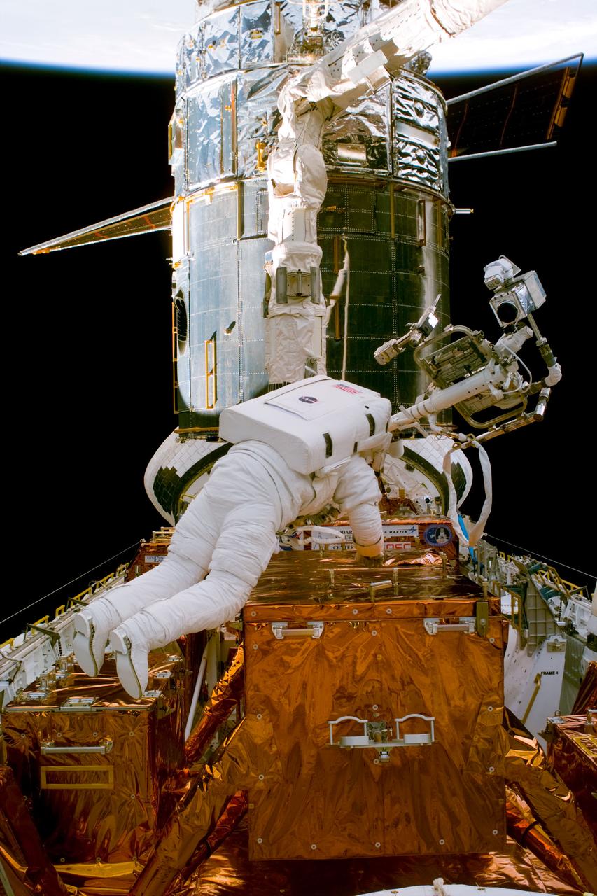 S82-E-5278 (14 Feb. 1997) --- Astronaut Steven L. Smith, STS-82 mission specialist, during Extravehicular Activity (EVA) setup, for the Hubble Space Telescope (HST) repair.  This view was taken with an Electronic Still Camera (ESC).