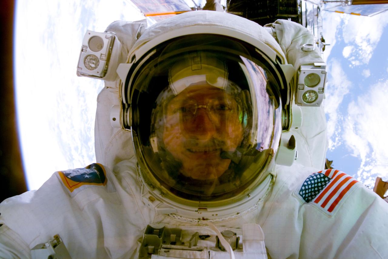 S82-E-5435 (15 Feb. 1997) --- Close-up view shows face of astronaut Joseph R. Tanner through his helmet visor on second Extravehicular Activity (EVA). This view was taken with an Electronic Still Camera (ESC).