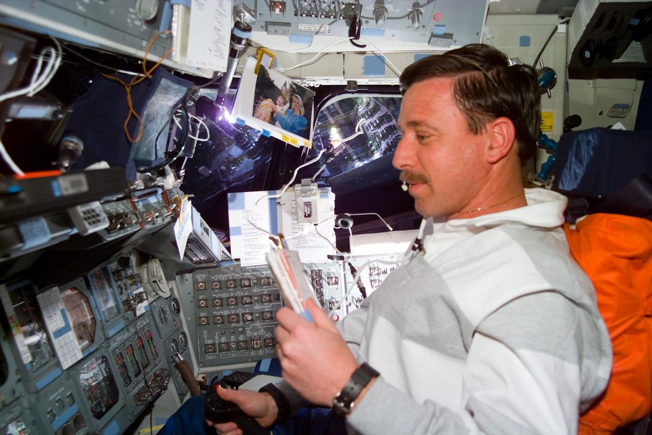 S82-E-5436 (15 Feb. 1997) --- Astronaut Scott J. Horowitz, STS-82 pilot, at pilot's station during second Extravehicular Activity (EVA) by two of his crew mates. This view was taken with an Electronic Still Camera (ESC).
