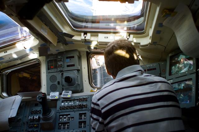 NASA image: Activity on the flight deck during EVA on Flight Day 7