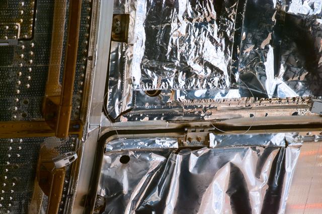 NASA image: HST,survey of the MLI patches installation