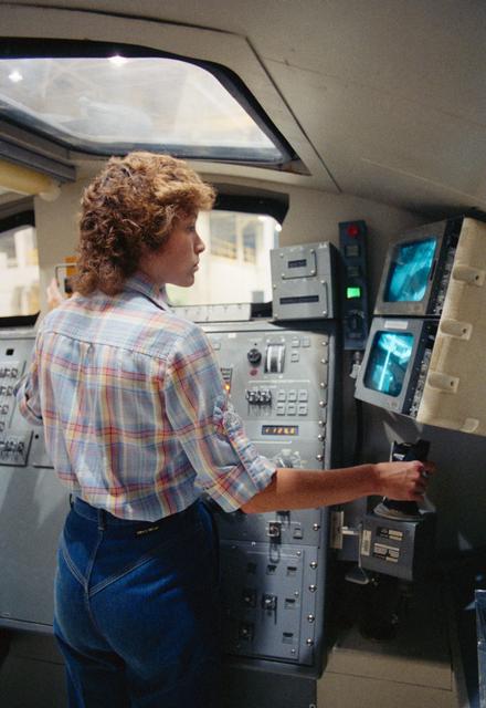 NASA image: Astronaut Anna Fisher practices control of the RMS in a trainer