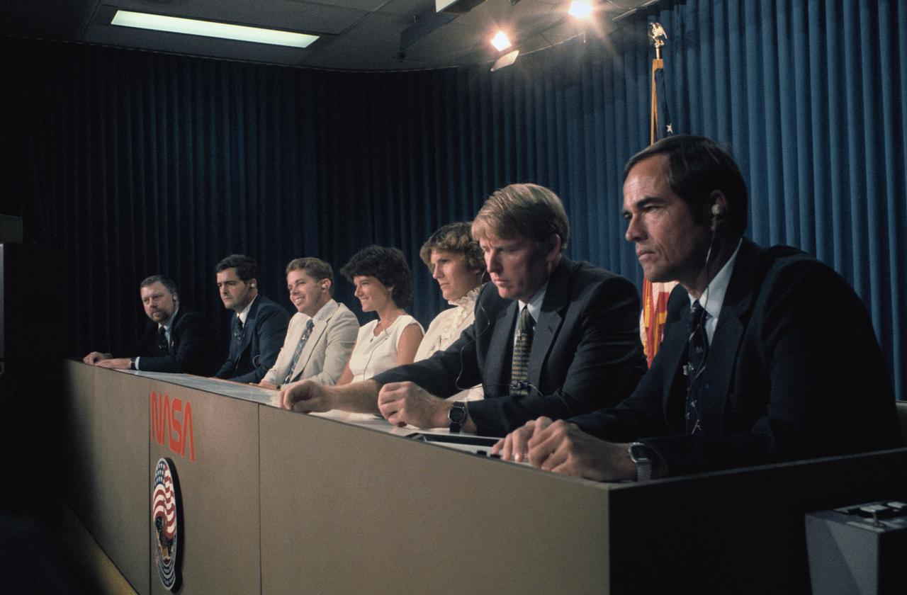 S84-41580 (3 Sept 1984) --- Assembled together publicly for the first time, the seven crewmembers for NASA's 41-G Space Shuttle mission field questions from the press corps at the Johnson Space Center.  Pictured (foreground right to left) are Robert L. Crippen, crew commander ;Jon A. McBride, pilot; Kathryn D. Sullivan, Sally K. Ride and David C. Leestma--all mission specialists; Marc Garneau, representing the Canadian National Research Council, and Paul D. Scully-Power, U.S. Navy oceanographer, both payload specialists. Their flight is scheduled for early October.