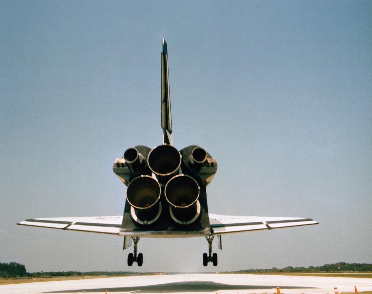 Landing of Orbiter Challenger at KSC at completion of 41G mission. View of the rear of the Orbiter as it approaches the runway with its landing gear extended. The main engines are clearly visible. The KSC Alternative Photo Number is 108-KSC-84PC-654 (43896).           KSC, FL