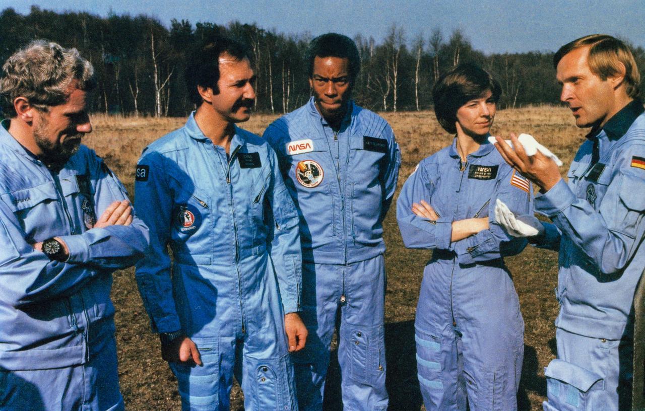 S84-47032 (13 Dec 1984) --- Candid view of part of the STS 61-A crew. From left to right are Reinhard Furrer, Wubbo Ockels, Guion S. Bluford, Bonnie J. Dunbar and Ernst Messerschmid.