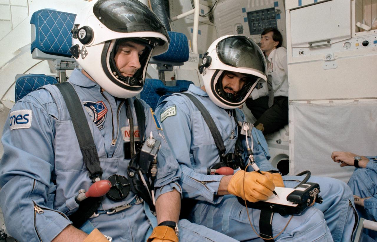 S85-32002 (17 May 1985) --- The two payload specialists for 51G participate in a training exercise in the Shuttle mission simulation and training facility at the Johnson Space Center (JSC).  Patrick Baudry, left, and Sultan Salman Abdelazize Al-Saud were briefed on the launch and entry phases of their upcoming flight.  The photo was taken by Otis Imboden.
