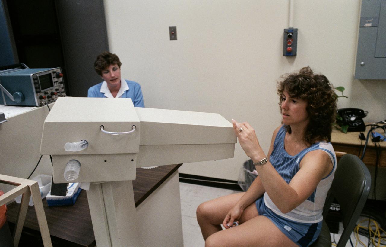 S85-36966 (10 July 1985) --- Teacher Sharon Christa McAuliffe prepares to test her lung capacity during medical examinations at the Johnson Space Center (JSC) clinic. Photo credit: NASA