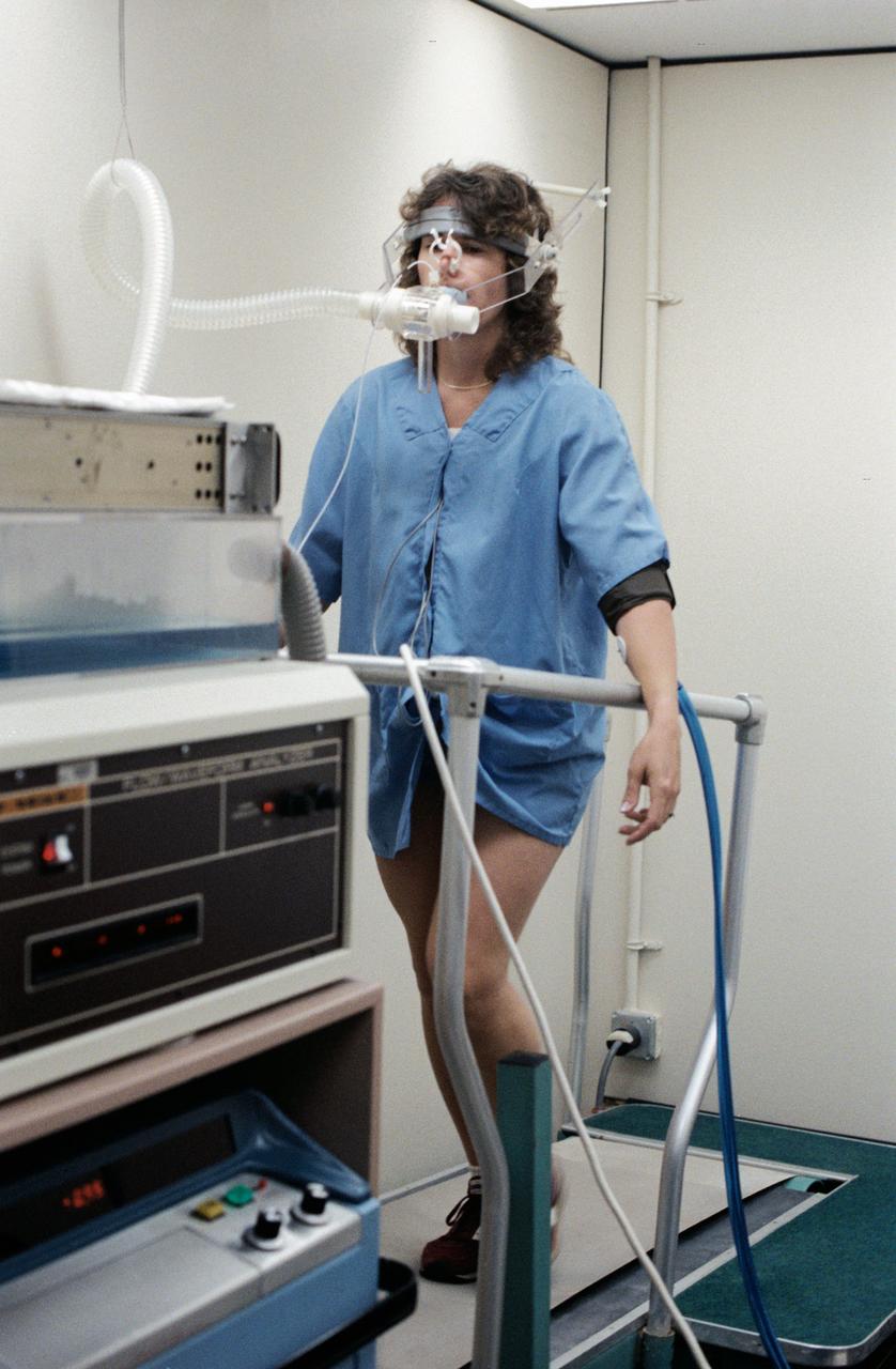S85-37165 (8-12 July 1985) -- Sharon C. (Christa) McAuliffe of Concord High, Concord, New Hampshire, runs in place on treadmill to test physiological responses at Johnson Space Center. Christa McAuliffe was eventually chosen as the first Teacher in Space and was a member of the seven-member Challenger shuttle crew which died tragically in the explosion of the spacecraft during the launch of STS-51L from the Kennedy Space Center about 11:40 a.m., EST, on Jan. 28, 1986. The explosion occurred 73 seconds into the flight as a result of a leak in one of two Solid Rocket Boosters that ignited the main liquid fuel tank. The crew members of the Challenger represented a cross-section of the American population in terms of race, gender, geography, background, and religion. The explosion became one of the most significant events of the 1980s, as billions around the world saw the accident on television and empathized with any one of the several crew members killed. Photo credit: NASA