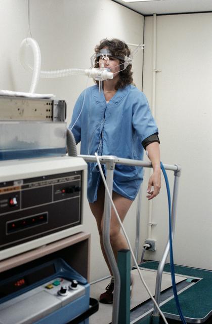 NASA image: Christa McAuliffe runs in place on a treadmill to test physiological response