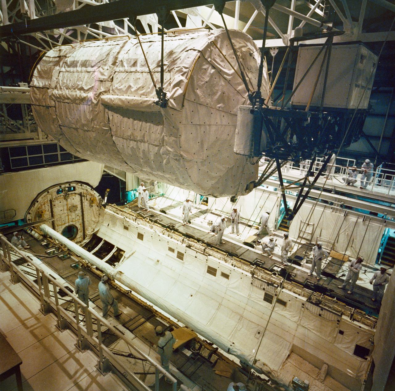 S85-43138 (20 Sept 1985) --- Spacelab D-1, the first payload dedicated to a German mission, is installed into the Space Shuttle Challenger in the orbiter processing facility (OPF) at the Kennedy Space Center. Launch for the 61-A eight crewmembers and their extensive scientific experiments is scheduled for no earlier than Oct. 30.