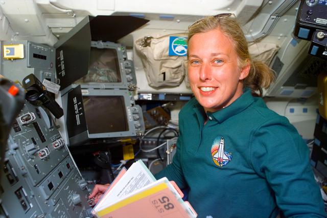 NASA image: MS Davis   at work in Discovery's flight deck
