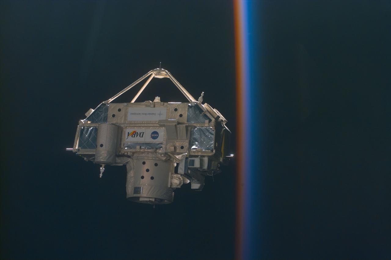 S85-E-5104 (15 August 1997) --- CRISTA-SPAS-2 appears "next" to a colorful pole, which is actually the atmosphere above Earth.  Moments later, the previously free-flying satellite was in the grasp of Discovery's remote manipulator system (RMS).