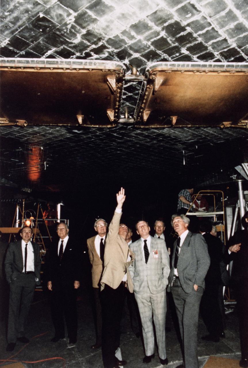 S86-28888 (14 Feb. 1986) --- NASA astronaut Robert Crippen points out Discovery tile work in the Vehicle Assembly Building to the Presidential Commission on the Space Shuttle Challenger Accident. The commission was taken to the facility on Feb. 14, 1986 as part of their investigation. Photo credit: NASA