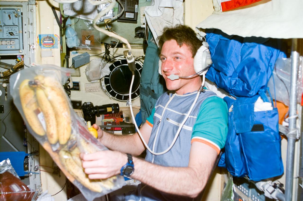 S86-E-5299 (27 Sept. 1997) --- Astronaut C. Michael Foale, cosmonaut guest researcher, shows his pleasure over a package of fresh fruit brought aboard Russia?s Mir Space Station by the STS-86 crew aboard the space shuttle Atlantis. This photograph captures Foale in his last hours as a cosmonaut guest researcher aboard Mir. Astronaut David A. Wolf, mission specialist, will replace Foale onboard the Mir, as cosmonaut guest researcher. This photograph was taken with the Electronic Still Camera (ESC) at 23:11:26 GMT on Sept. 27, 1997. Photo credit: NASA