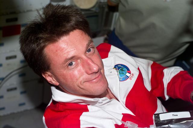 NASA image: Foale on middeck with tea