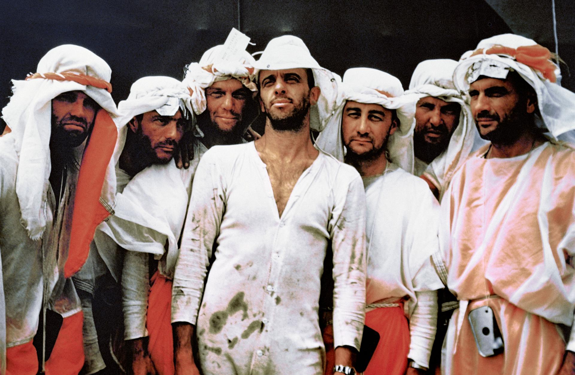 The original seven astronauts posing during a training excercise.