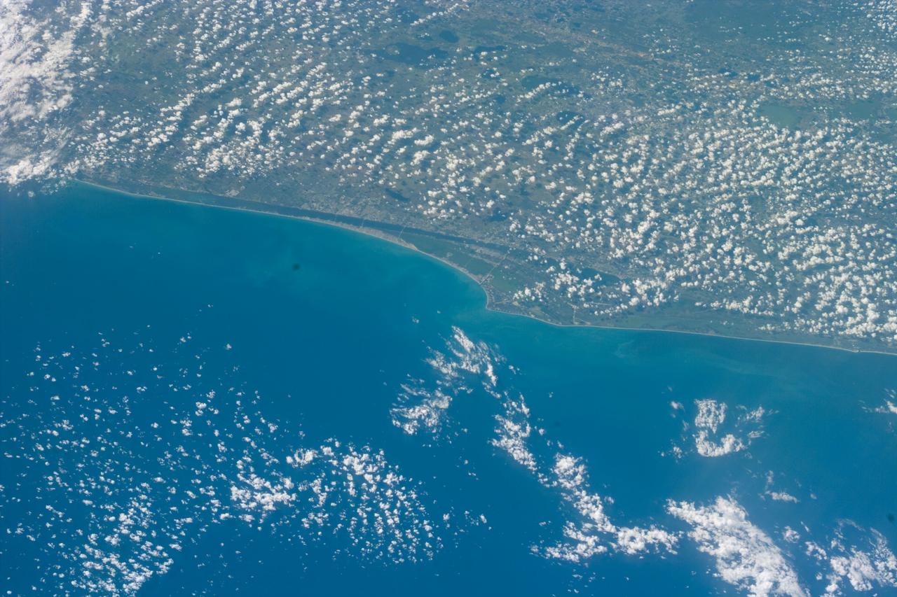 S88-E-5021 (12-05-98) --- Central and southern Florida show scattered clouds in this electronic still camera's view downlinked from the Space Shuttle Endeavour on Dec. 5. Cape Canaveral and the Kennedy Space Center (KSC) environs can be easily delineated near frame's center. The photo was taken at 16:31:07 GMT, Dec. 5, and later downlinked to flight controllers.