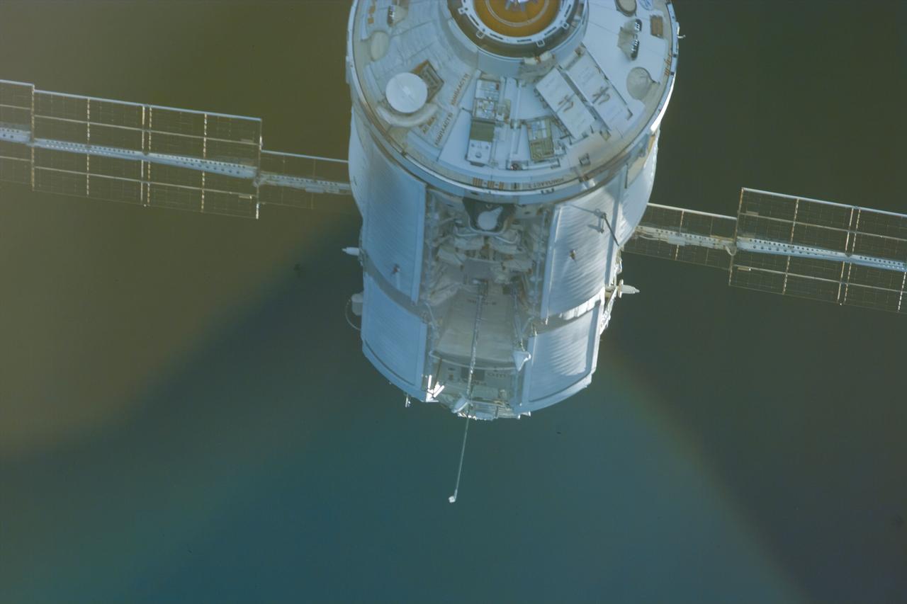 S88-E-5044 (12-06-98) --- With Endeavour's astronauts waiting to mate the Russian-built Zarya control module with the U.S.-built Unity connecting module, an electronic still camera (ESC) was used to record this image of the approaching Zarya.  Using the shuttle's 50-ft.-long Canadian-built robot arm, astronaut Nancy J. Currie, working from Endeavour's aft flight deck, plucked Zarya out of orbit at 5:47 p.m. (CST), Dec. 6.  The craft had been orbiting Earth for a little over 16 days prior to the grapple and subsequent docking to Unity.  This image was recorded at 22:53:55 GMT, Dec. 6.